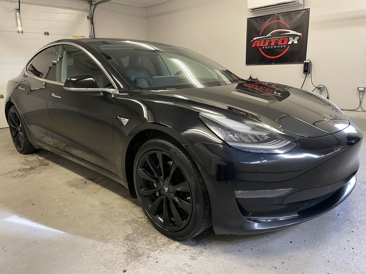 2018 Tesla Model 3 Long Range Dual Motor, front three-quarter view